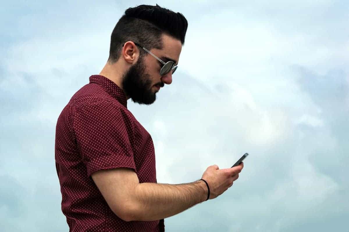 man looking at a cellphone