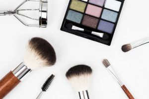 makeup products eye shadow, eyelash curler, and various brushes. photo source pixabay
