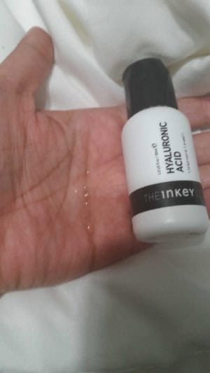 The INKEY List Hyaluronic Acid in hand with bottle