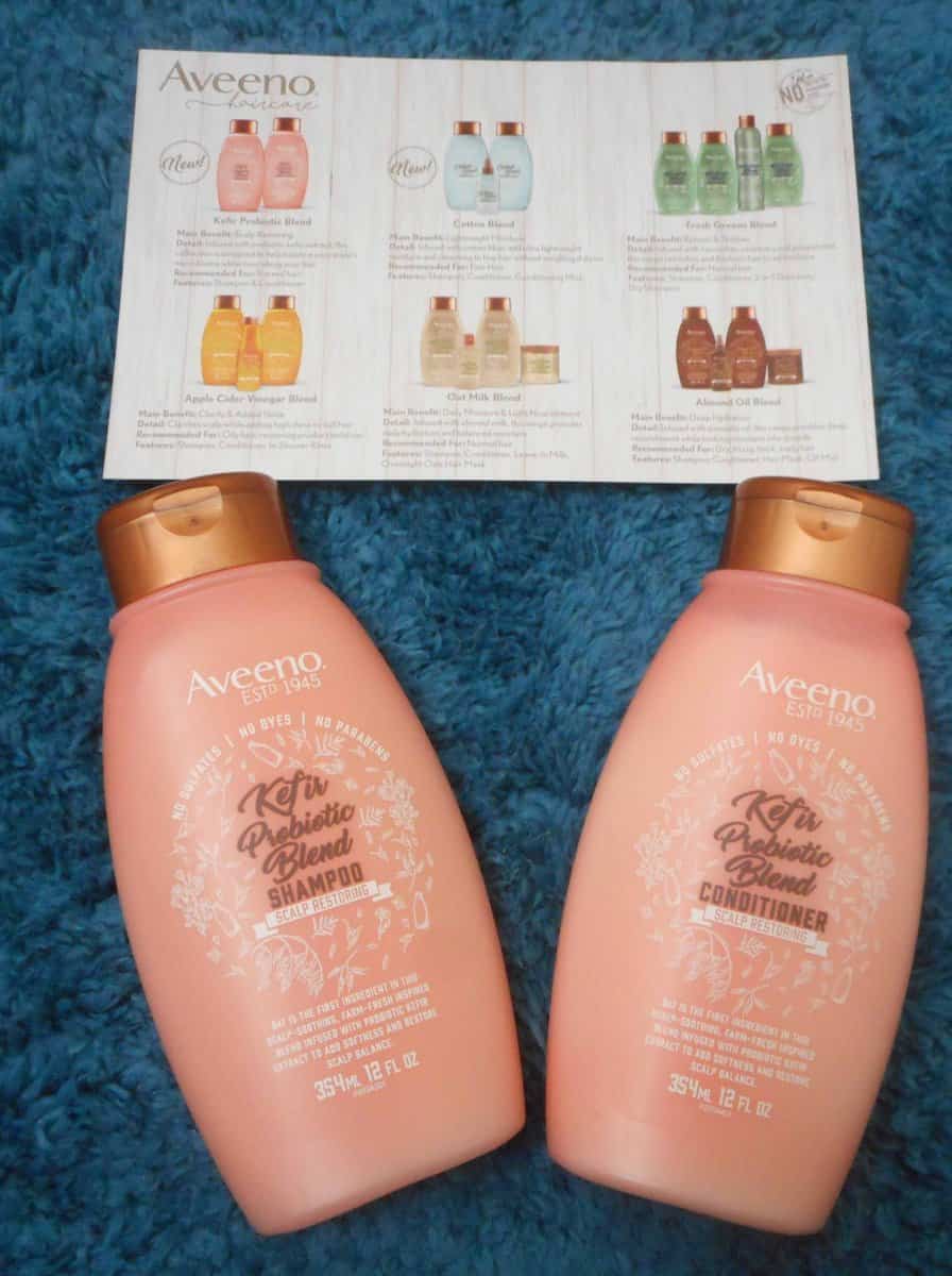 AVEENO® Kefir Probiotic Blend Shampoo & conditioner scalp restoration formula with info card sharing all the Aveeno brand hair care products.