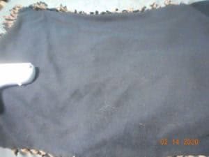 Back of blanket before using lint roller