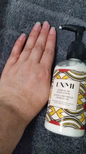 LXMI CRÈME DU NIL BODY LOTION bottle lotion absorbed into my hand