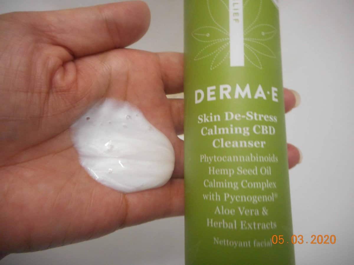 Derma-E Skin De-stress calming CBD Cleanser bottle with cleanser in hand