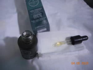 Botanics Restoring Overnight Facial Oil dropper on tissue