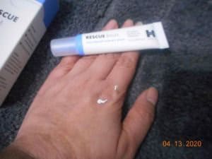 Rescue Balm Post Blemish recovery cream Hero Cosmetics on my hand with tube