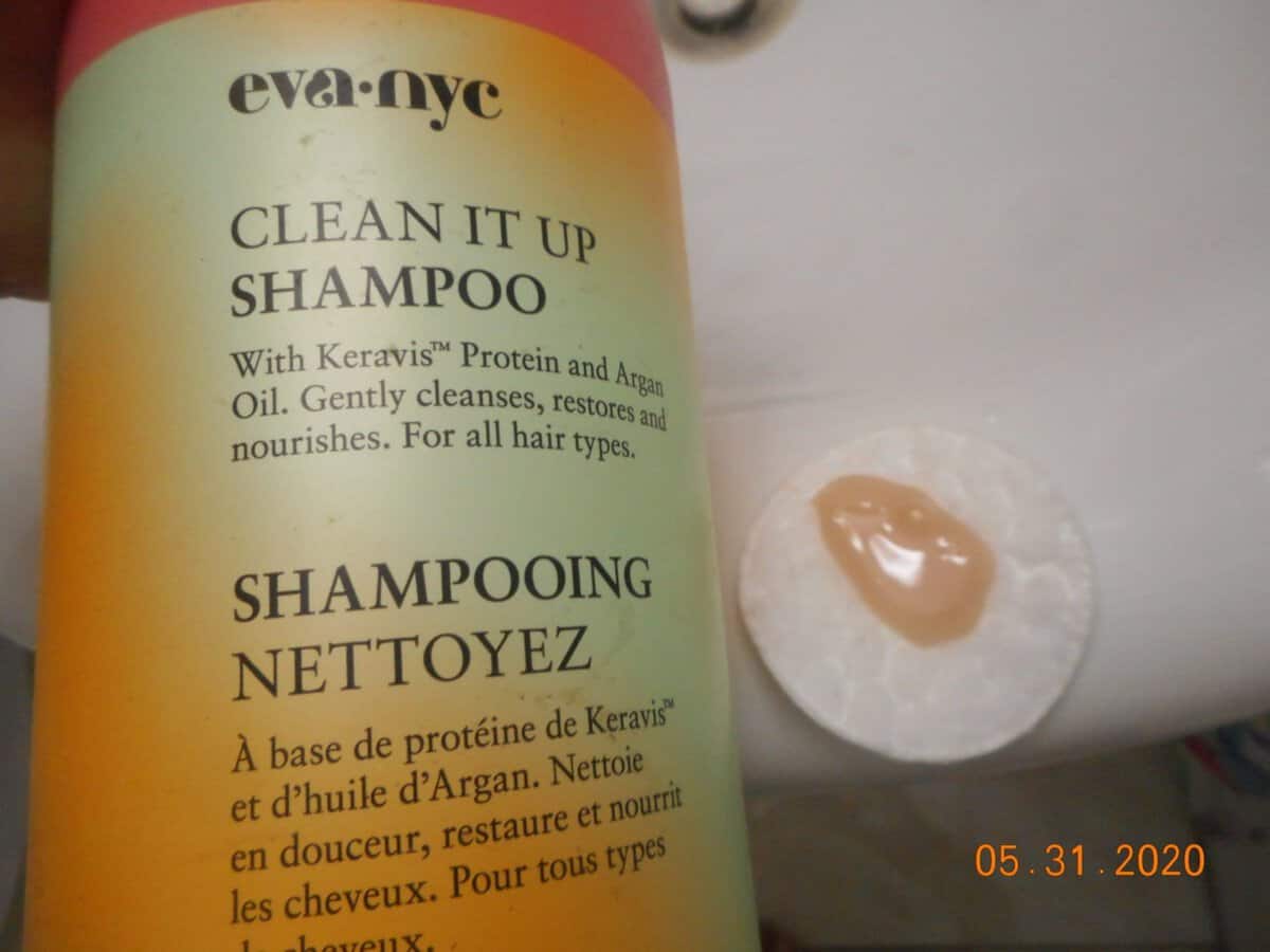 Clean It Up Shampoo with a small amount of shampoo on a cotton pad