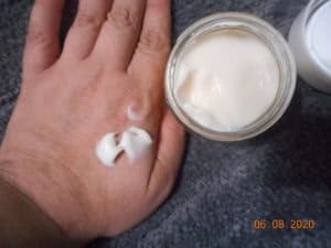 Derma-E Vitamin C Intense Night Cream on my hand. Hand next to open jar