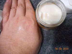 Derma-E Vitamin C Intense Night Cream absorbed into my hand. Hand next to open jar