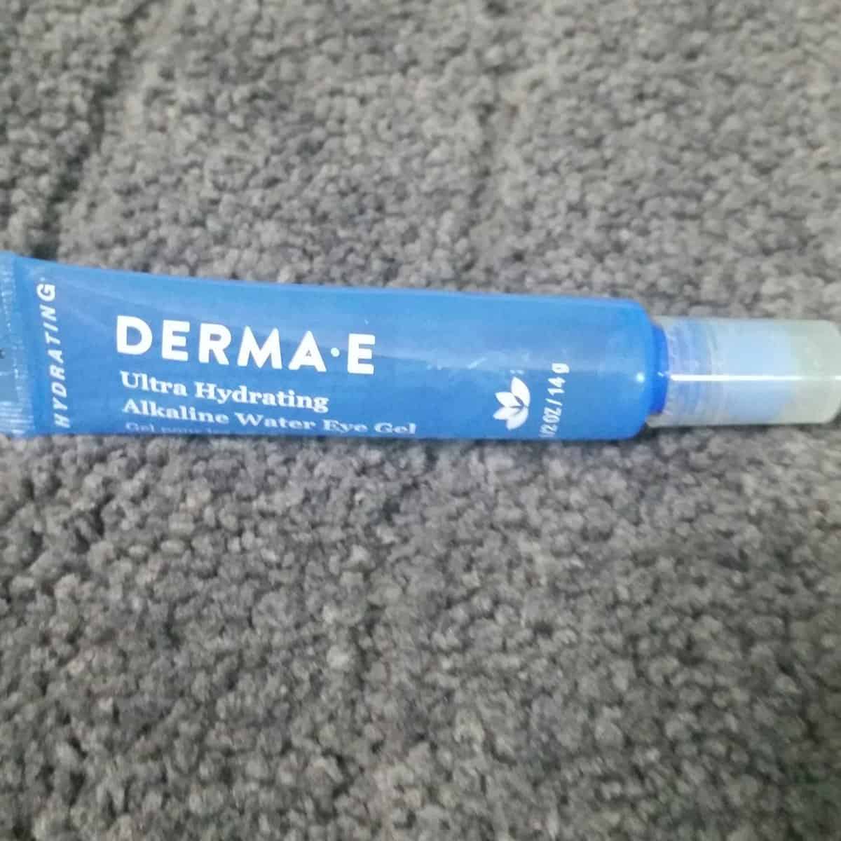 DERMA E ULTRA HYDRATING ALKALINE WATER EYE GEL tube. blue tube with white text.