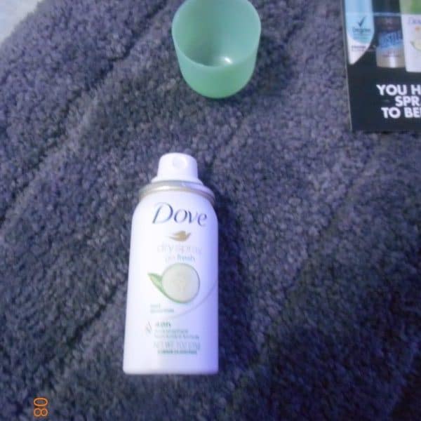 Dove Dry Spray Antiperspirant Deodorant, Cool Essentials sample with lid removed.