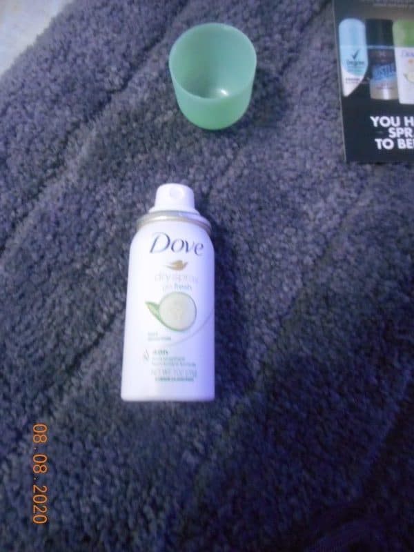 Dove Dry Spray Antiperspirant Deodorant, Cool Essentials sample with lid removed.
