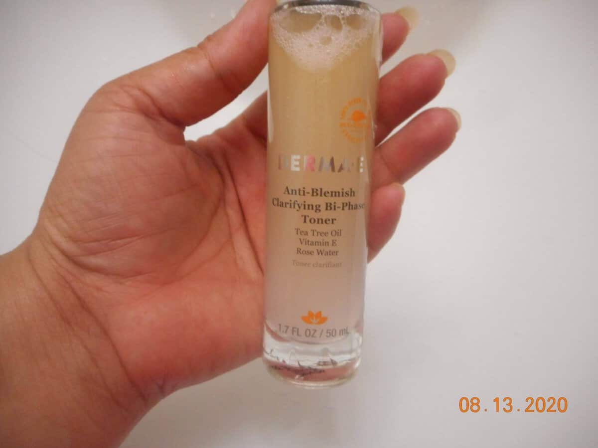 Anti-Blemish Clarifying Bi-Phase Toner bottle in my hand.