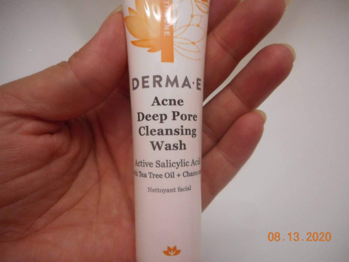 Derma-E Deep Pore Cleansing Wash tube in hand.