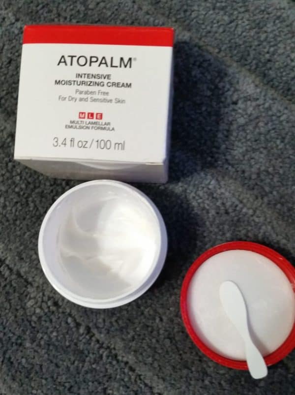 Atopalm Intensive Moisturizing Cream box with open jar with spatula on lid.