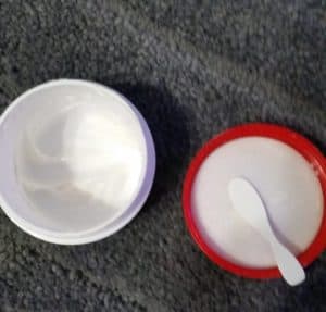 Atopalm Intensive Moisturizing Cream open jar with spatula on lid.