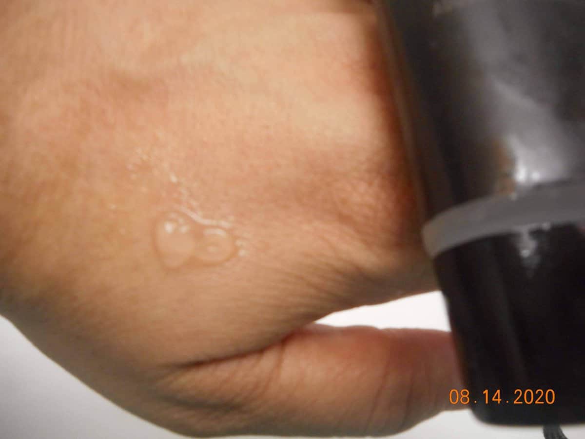 NYX primer studio perfect clear formula.. dime size amount of primer on the top of my hand. closer view.