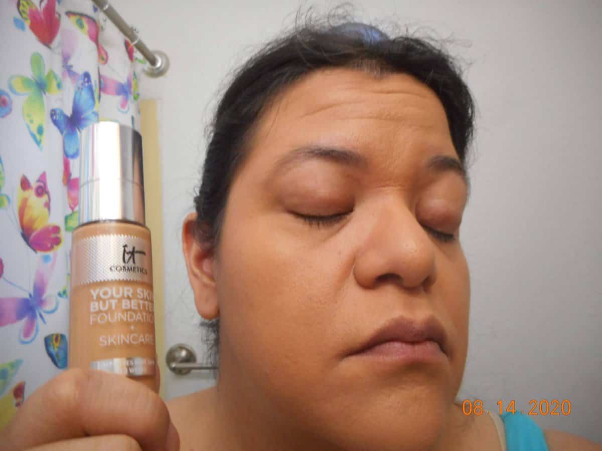 Your Skin But Better Foundation + Skincare Tan Neutral 42 applied to face. Right side with bottle next to my face.