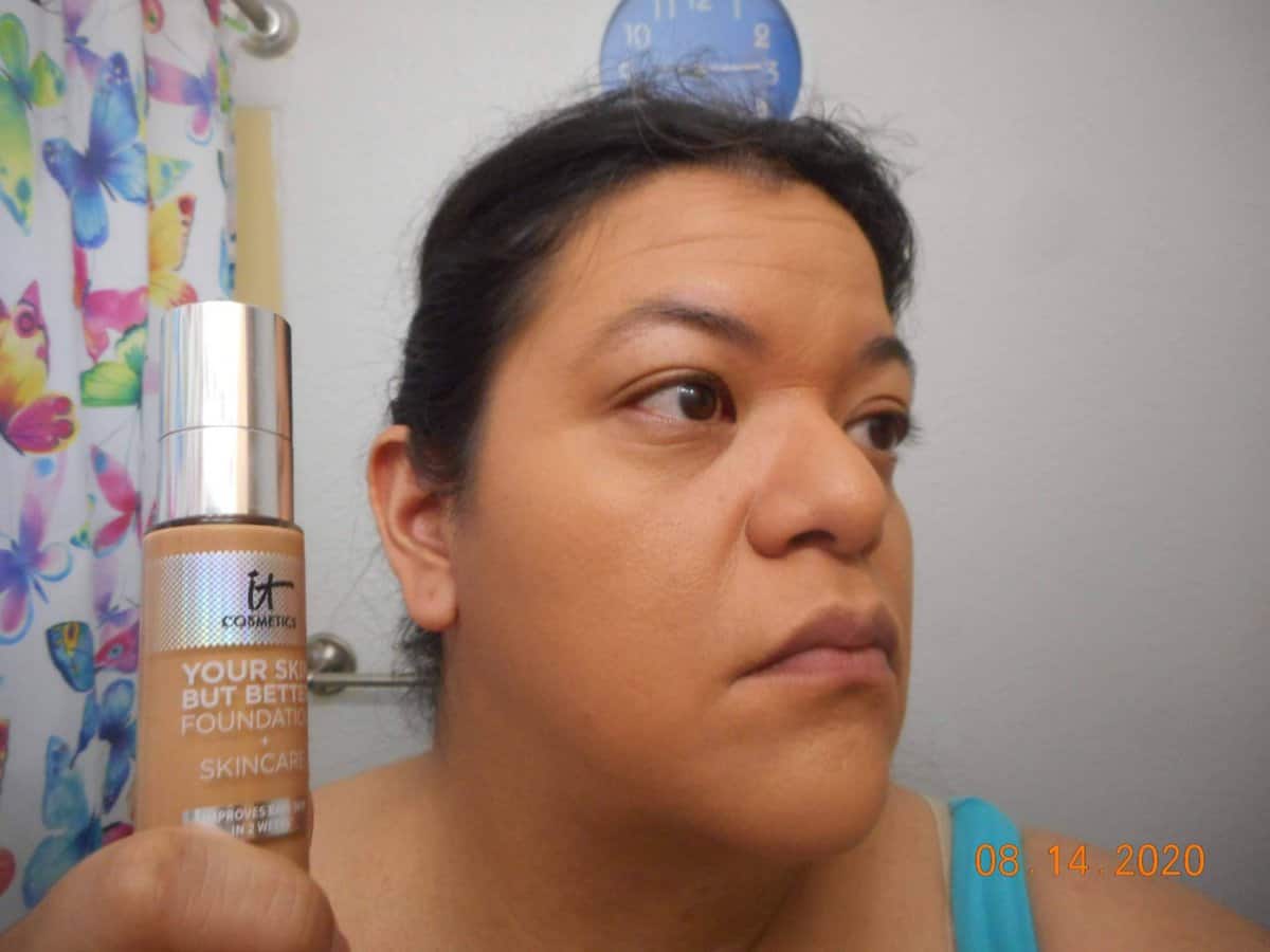 Wider shot of Your Skin But Better Foundation + Skincare Tan Neutral 42 applied to face. Right side with bottle next to my face.