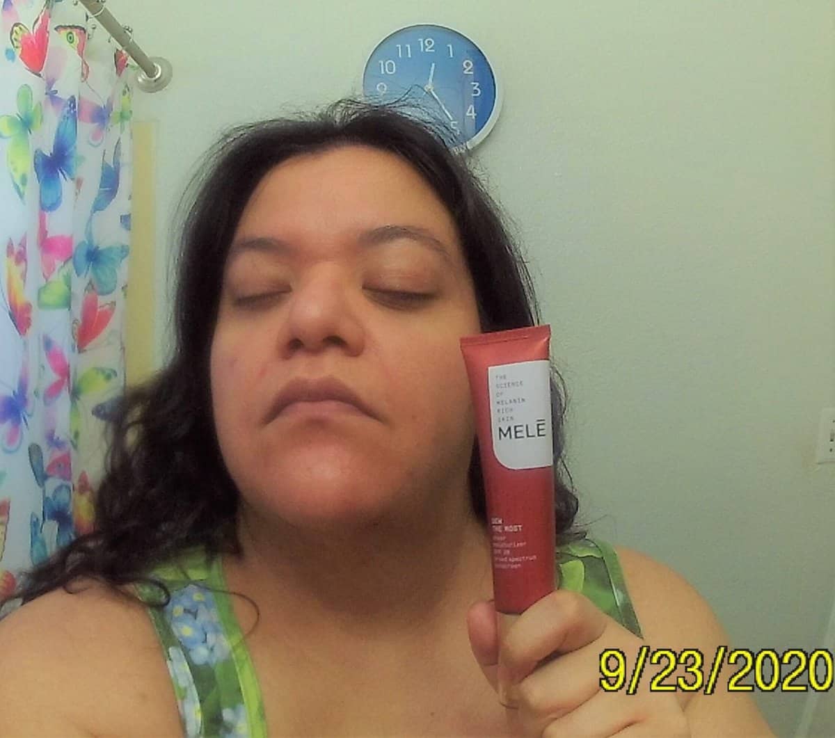 Mele DEW THE MOST moisturizer applied ot my face. Tube in my hand.