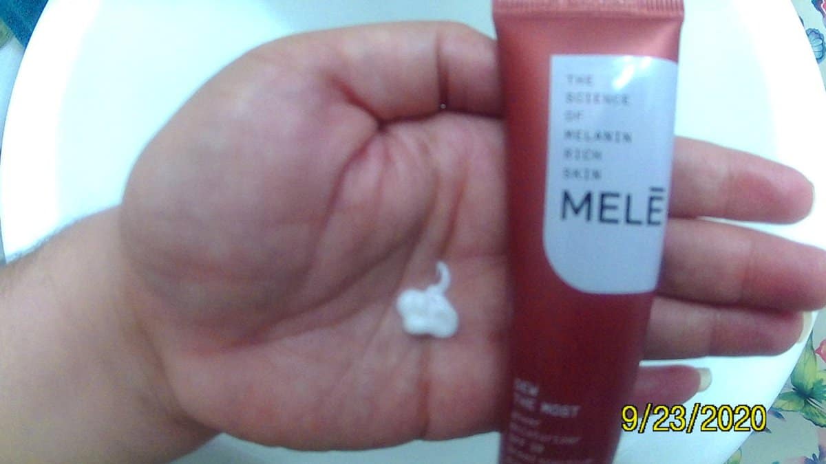 mele skincare tube with DEW THE MOST moisturizer in my hand.