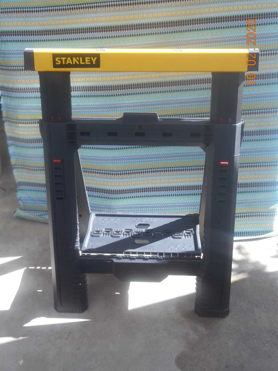 Stanley adustable sawhorse infront of DIY background.