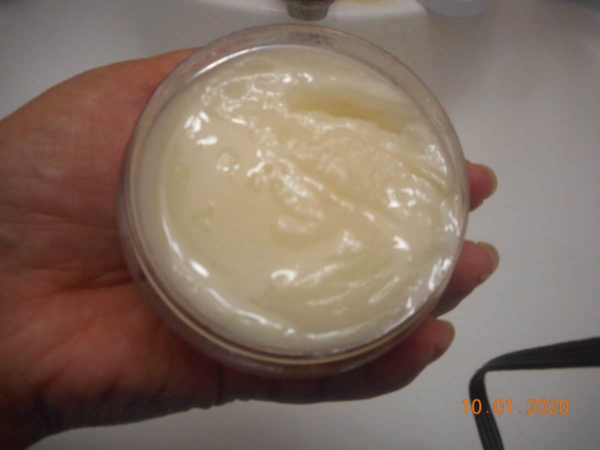 Universal cleansing balm open jar top view.