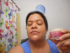 universal cleansing balm applied ot my face. open jar in my hand.