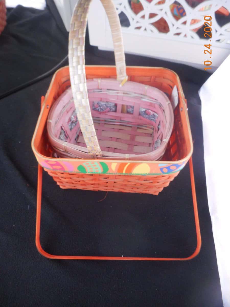 two baskets. a smaller one placed inside a larger one.