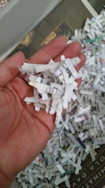 shredded paper in my hand. close up of shredded paper.