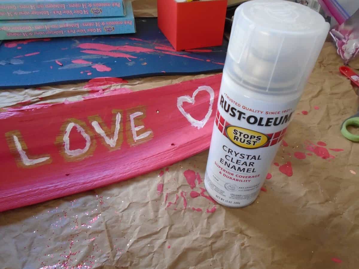 rustoleum crystal clear enamel spray in front of painted Love sign.