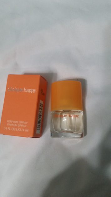 clinique happy scent sample. box with small perfume sample. Orange box with orange top small perfume bottle.