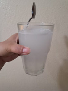 Collagen Candy mixed into a glass of water.