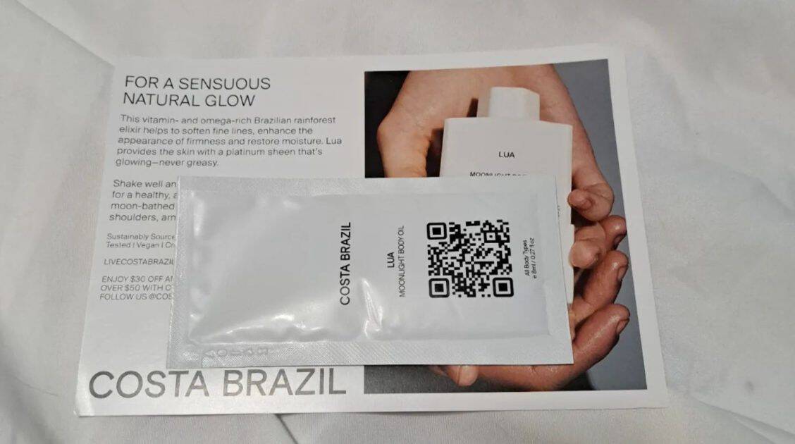 costa Brazil Lua body oil pack with info card.