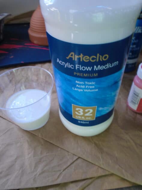 Artecho paint medium in cup. with bottle.