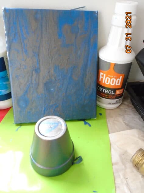 paint poured canvas and small pot using Flood Floetrol.