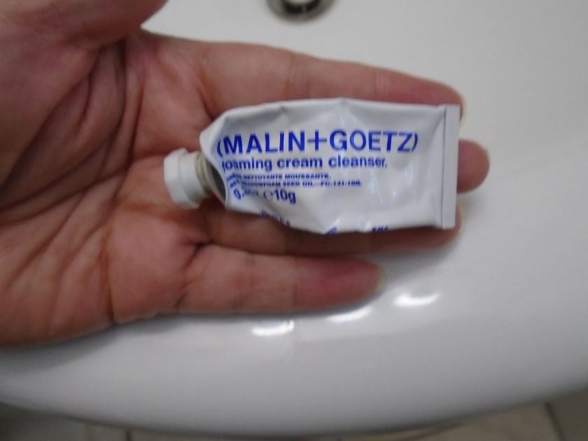 malin + Goetz foaming cream cleanser tube after a few uses.