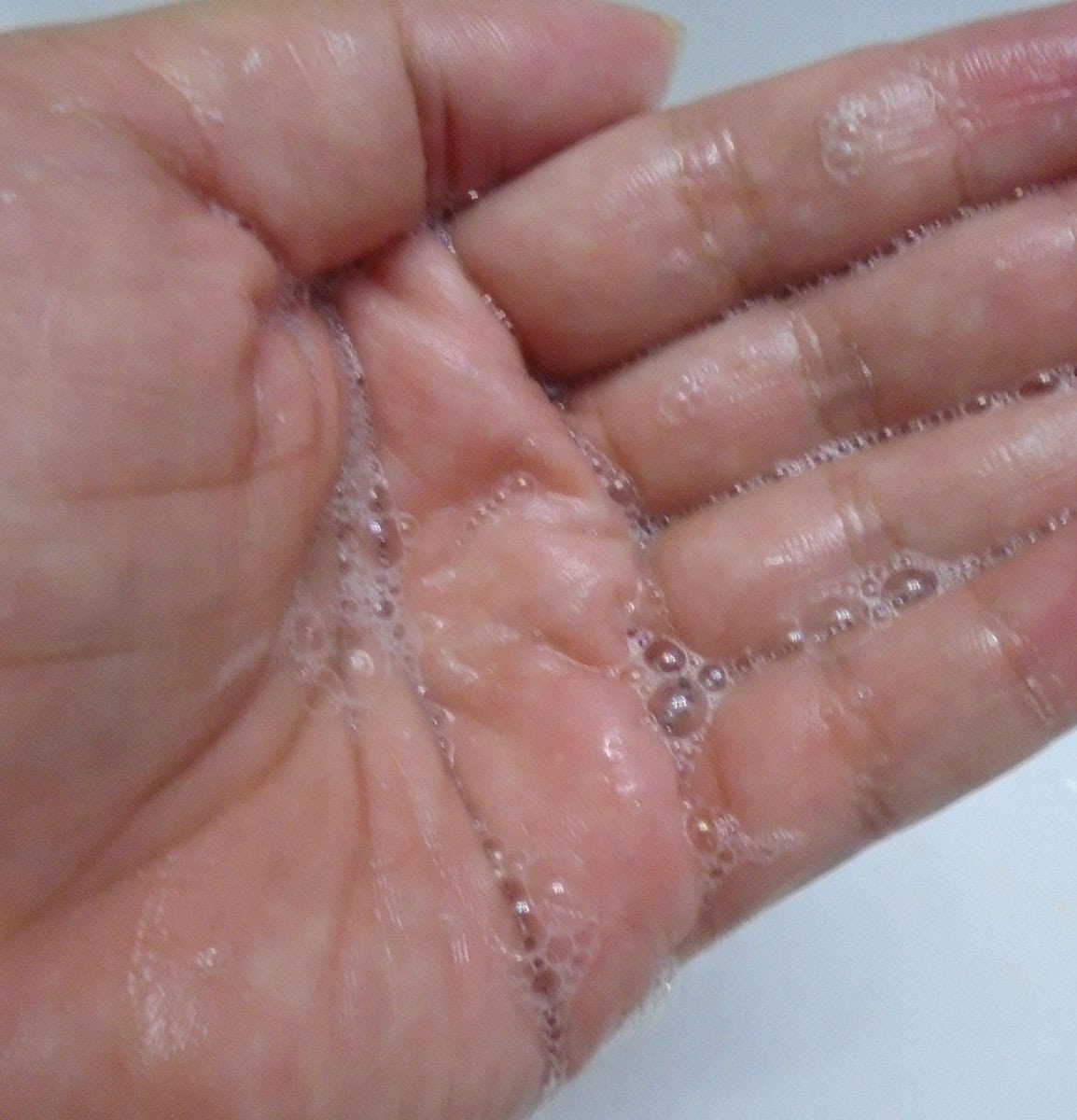 Aveeno body wash lather in my hand.