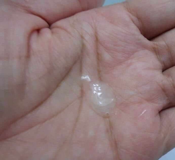 close up of aveeno body wash in my hand.