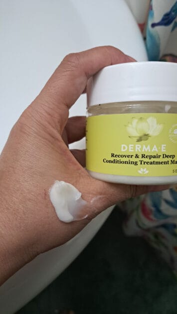 Derma-E Recover and Repair Deep Conditioning Hair Treatment jar with conditioner on my hand. a white or beige cream product.