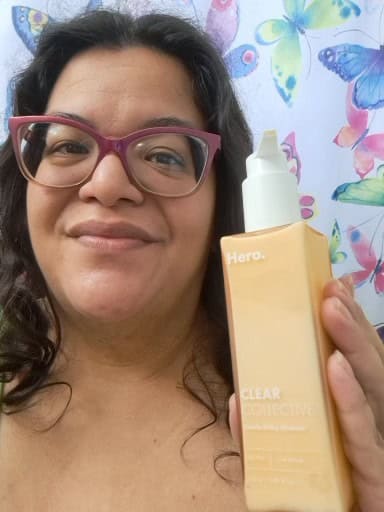 me (v) holding Hero cosmetics milky gentle cleanser botte..