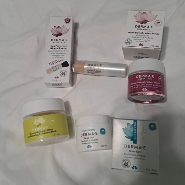 an array of derma-e products. sunscreen, microdermabrasion cleanser, hair mask, and a scar gel.