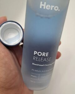 Hero Pore release blackhead clearing solution in the cap with the bottle.