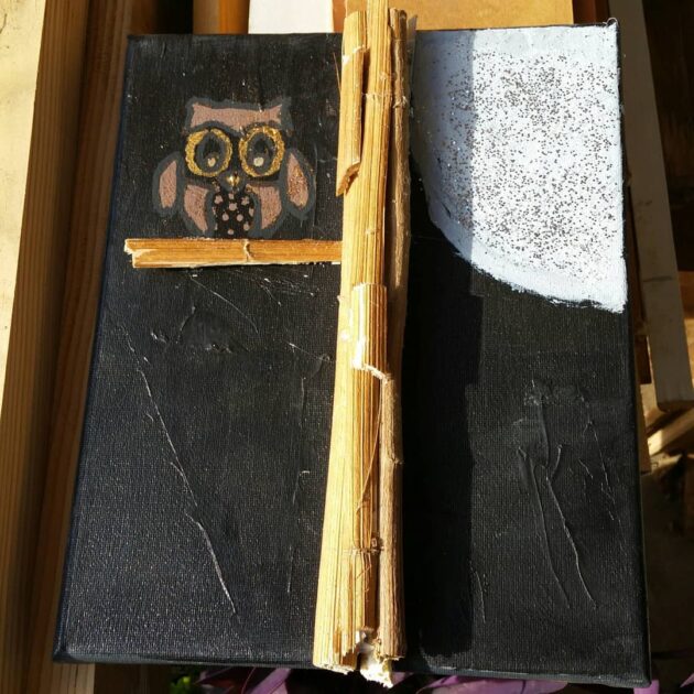 hand-made mixed media panting. and owl on a branch next to the full moon.