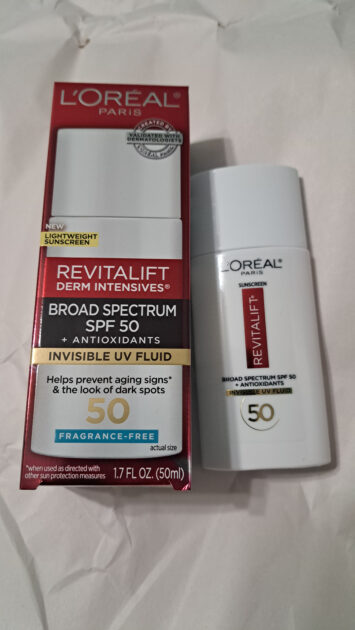 REVITALIFT DERM INTENSIVES Broad Spectrum SPF 50 Invisible UV Fluid box with spf bottle.