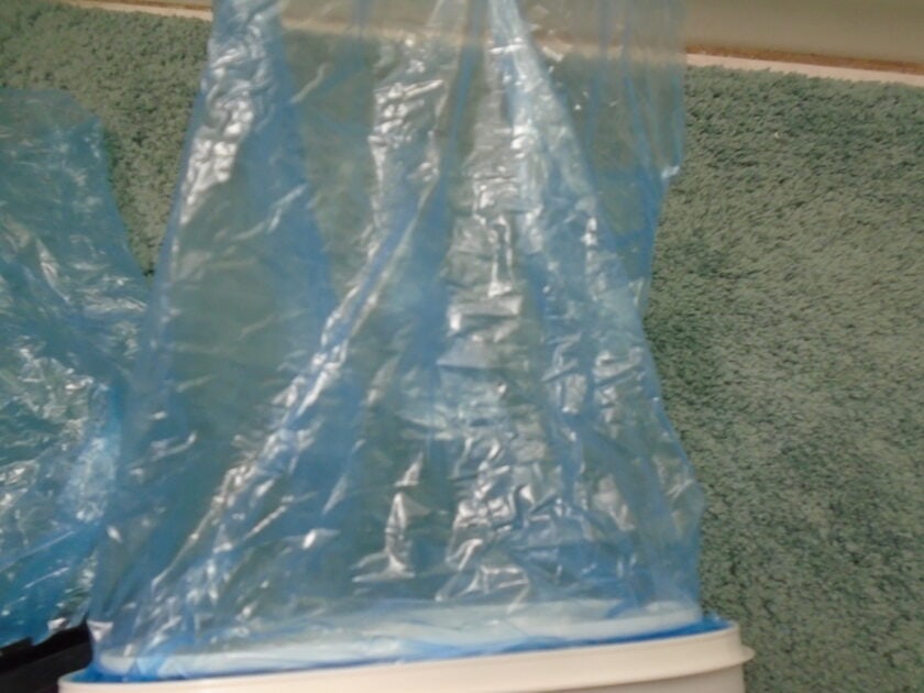 cloes up of up and up litter bag. light blue multi-layer bag.