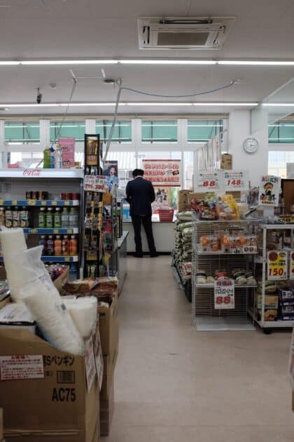 man standing on store counter during daytime image from unsplash dot com.