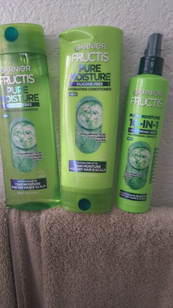 Garnier Fructis pure moisture products. Shampoo (right0 conditioner (middle) 10 in 1 spray (left) in natural light