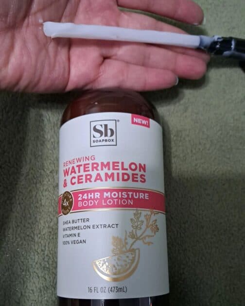 SoapBox Watermelon and Ceramides Body Lotion bottle. with pump top removed to show white lotion.