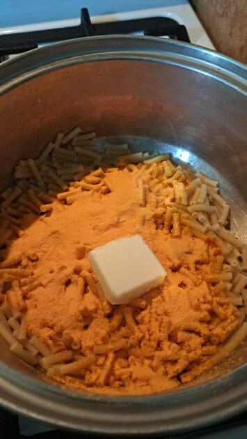 Cheese powder and a pat of butter added to Goodles cheddy mac.