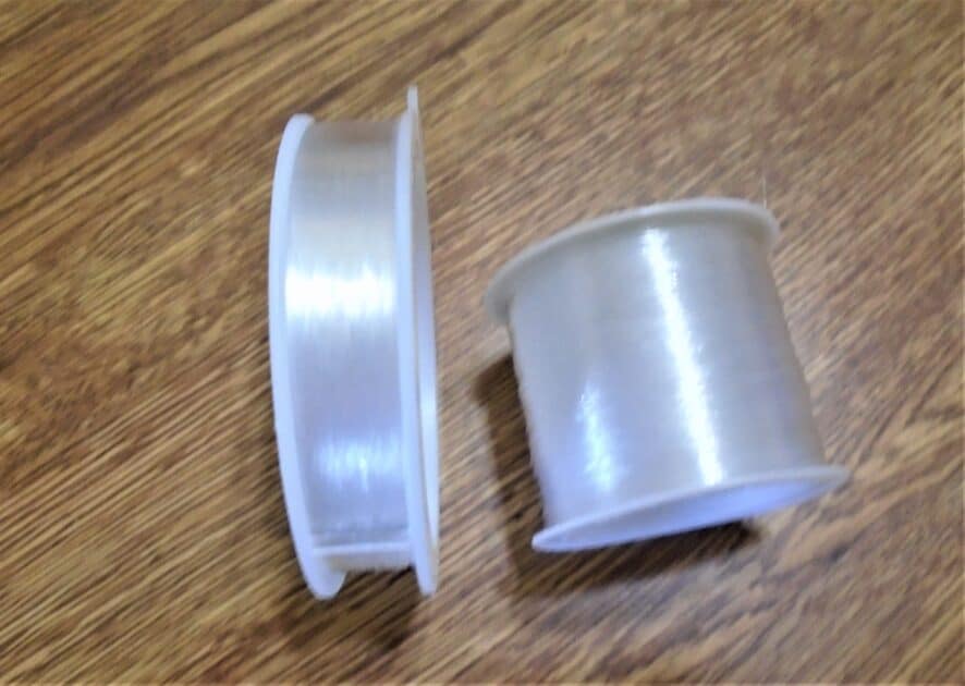 two spools of monofilament thread.